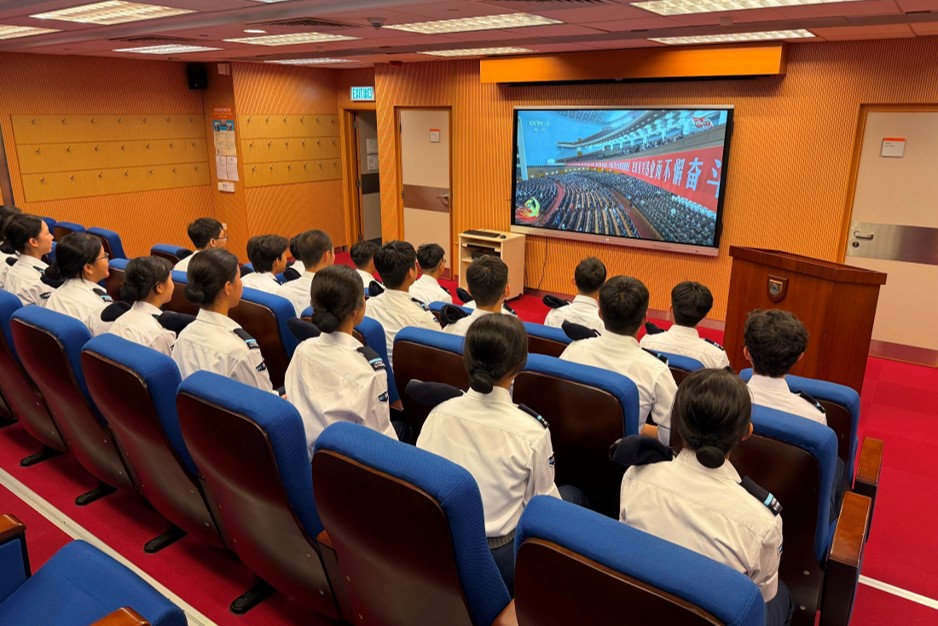 Members of the Immigration Department Youth Leaders Corps watching the live broadcast of the Grand Assembly marking the 105th Anniversary of the founding of the Communist Party of China